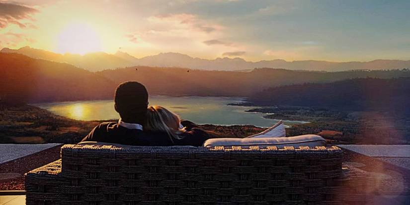 Chidi and Eleanor on a couch overlooking scenery in The Good Place series finale Whenever You're Ready.