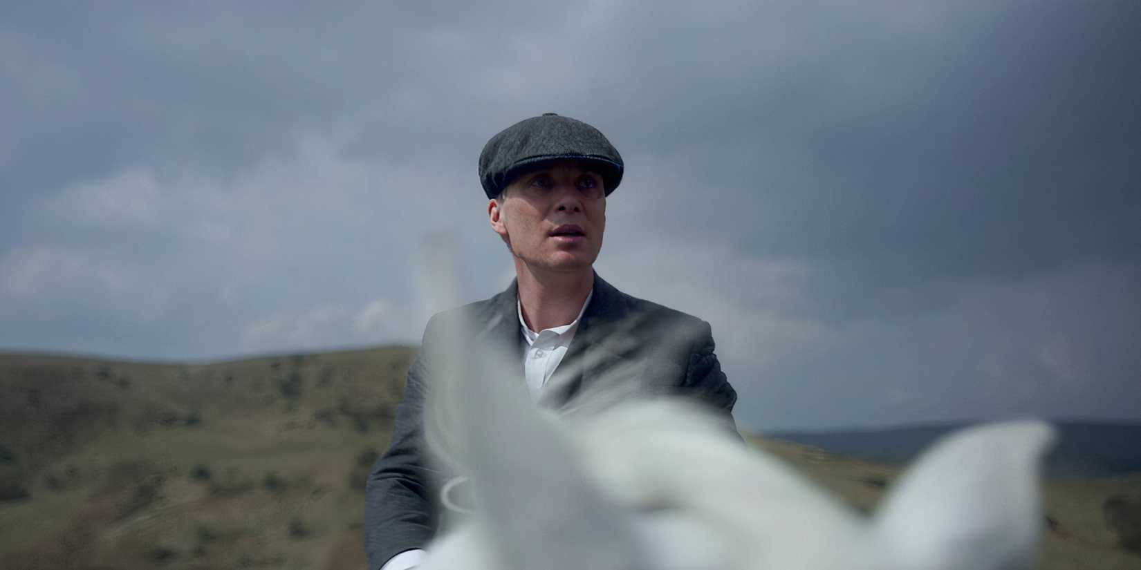 Cillian Murphy riding a horse in Peaky Blinders.