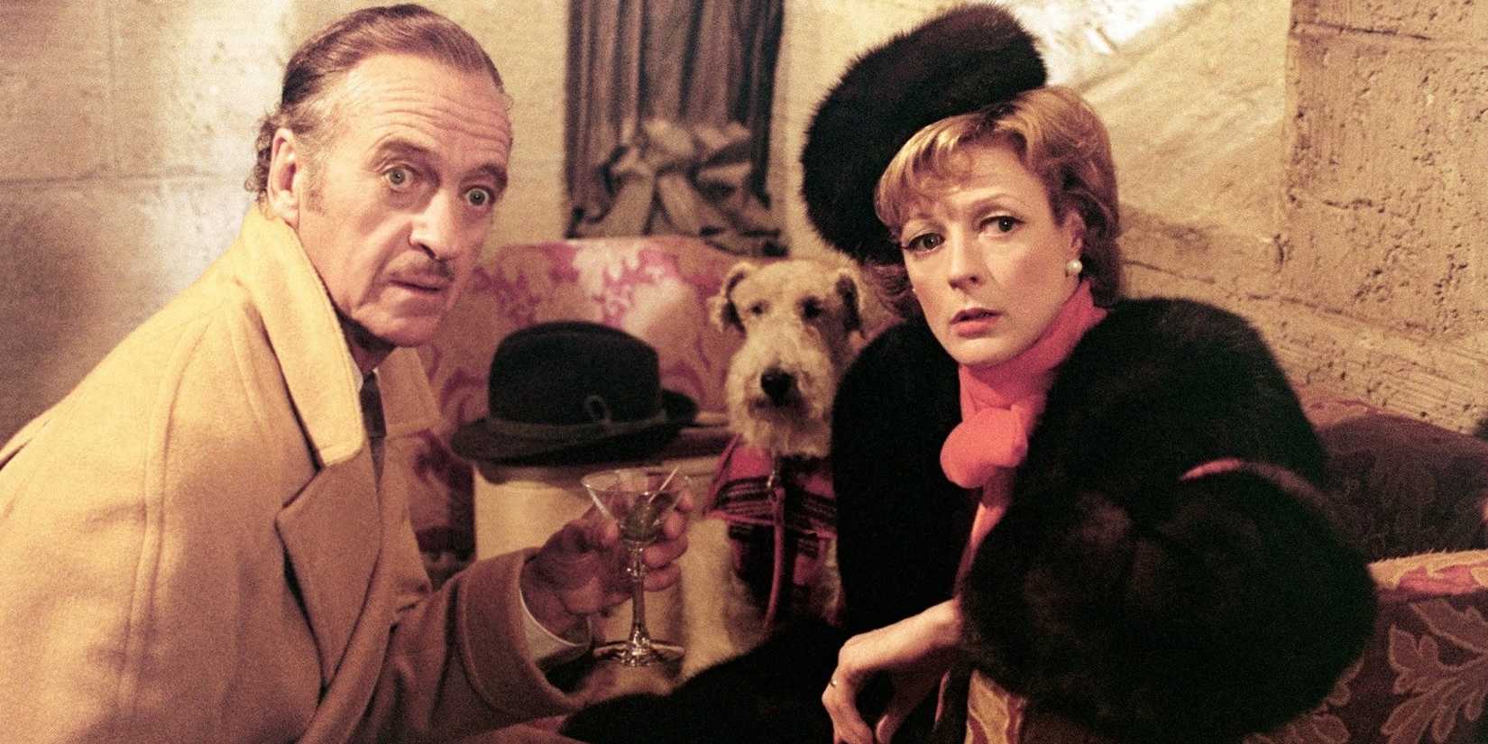 Dickie Charleston, played by David Niven, and wife, played by Maggie Smith, look on in horror in Murder by Death