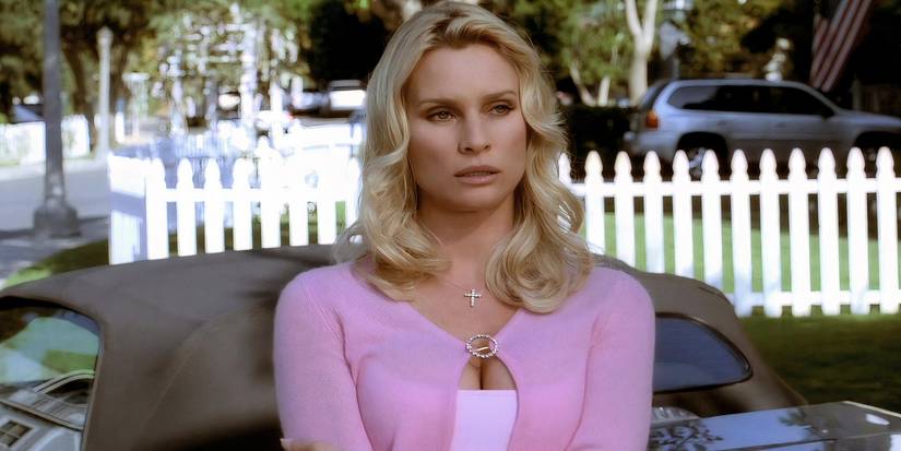 Edie outside of her house with arms folded looking angry in Desperate Housewives.