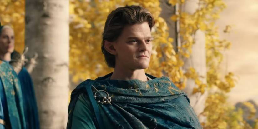 Robert Aramayo as Elrond standing outside looking regal in The Lord of the Rings: The Rings of Power