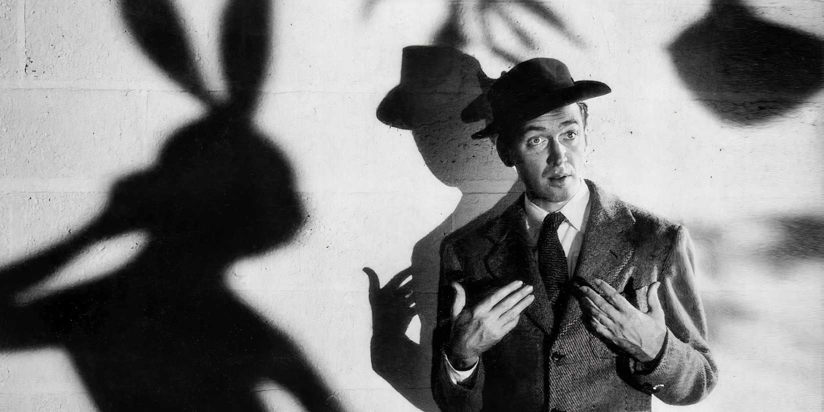 James Stewart with the shadow of a bunny behind him in Harvey - 1950