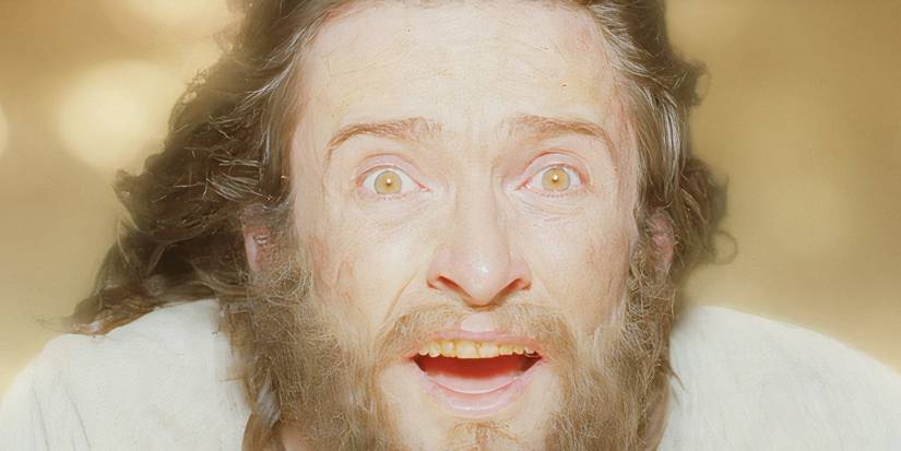 Hugh Jackman looking emotional while wind blows on his face in The Fountain