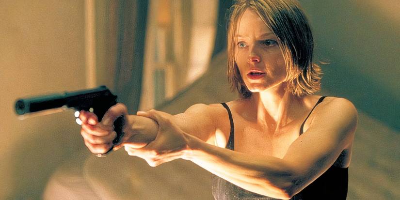 Jodie Foster aims a handgun off screen in David Fincher's 'Panic Room'