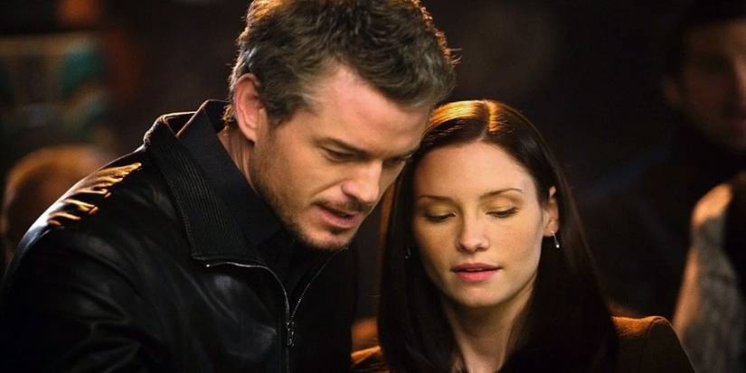 Mark Sloan and Lexie Grey looking down at something in Grey's Anatomy. 