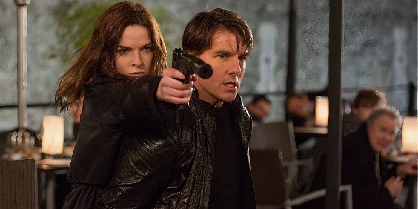 Ilsa aims a gun over Ethan Hunt's shoulder in a restaurant
