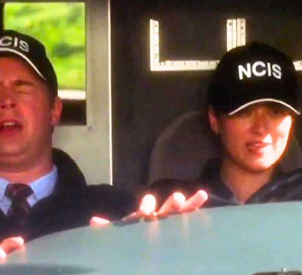 Ziva, played by actress Cote De Pablo, happily drives the NCIS van while Agent Timothy McGee, played by Sean Murray, develops motion sickness