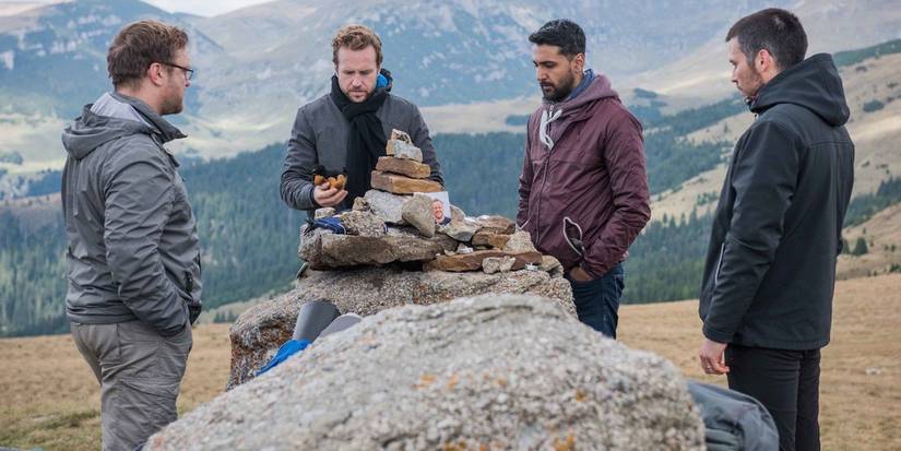 Sam Troughton, Rafe Spall, Arsher Ali, Robert James-Collier standing together in The Ritual