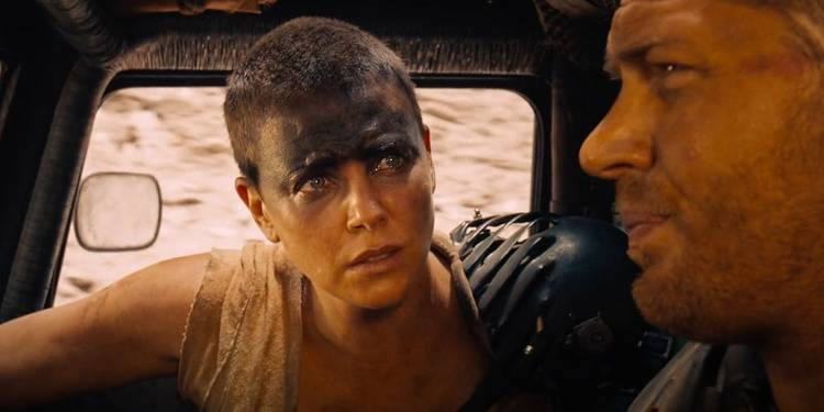 Furiosa talking to Max inside a car in Mad Max: Fury Road (2015).