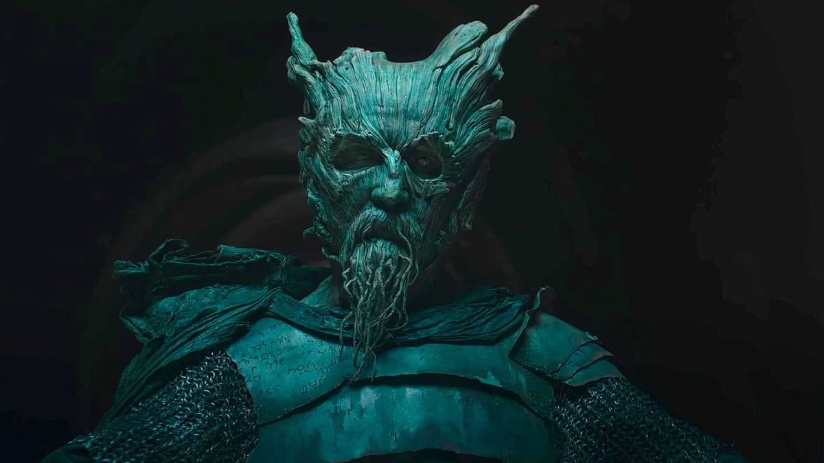 The Green Knight looking at the camera intently in The Green Knight