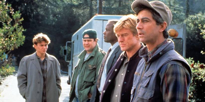 The main cast stands outside in a line looking concerned in Sneakers