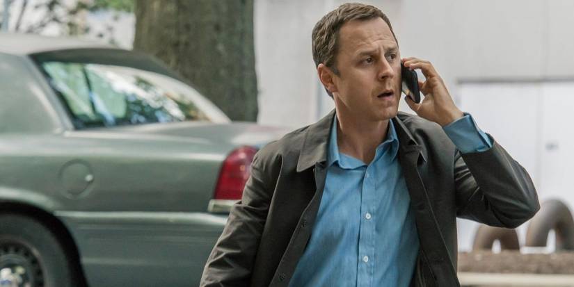 Giovanni Ribisi talking on a phone and walking across a street in 'Sneaky Pete'.