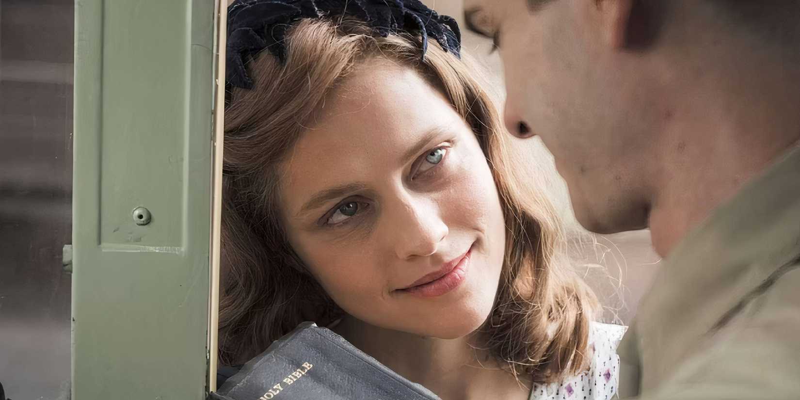 Teresa Palmer as Dorothy Schutte in 'Hacksaw Ridge' smiling while looking at Andrew Garfield as Desmond Doss.