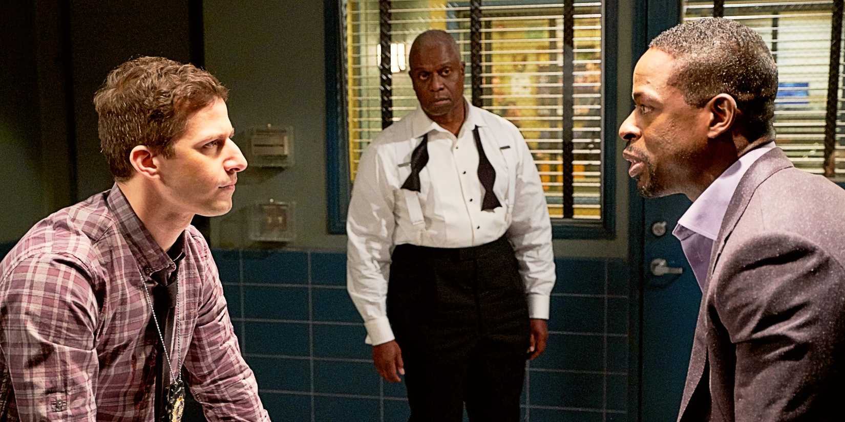Jake Peralta and Philip stare at each other with Captain Holt nearby in 'Brooklyn Nine-Nine's "The Box".