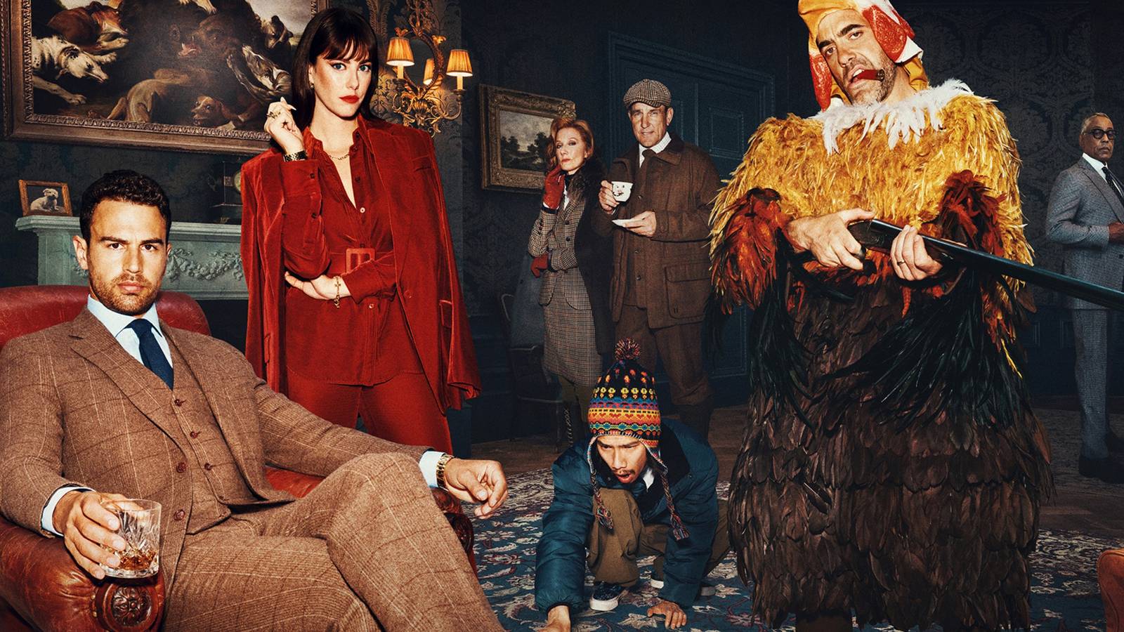 Daniel Ings in a chicken suit with a gun and Theo James & Kaya Scodelario in The Gentlemen