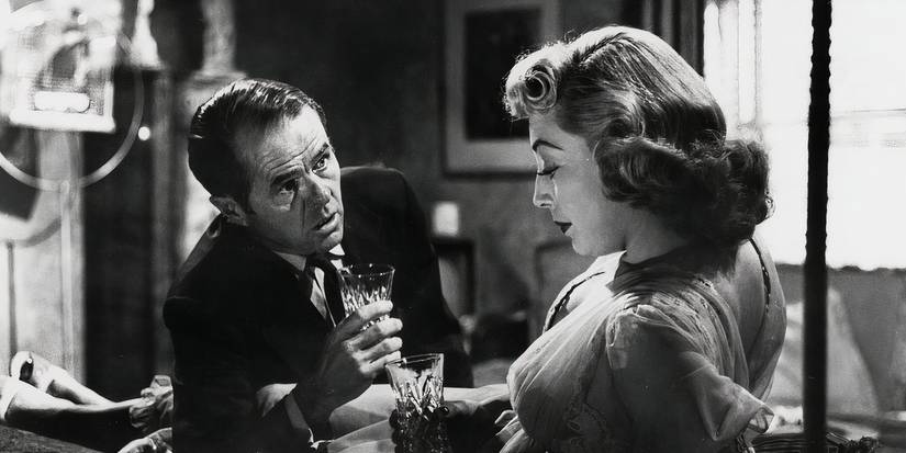 Elisha Cook Jr. as George Peatty and Marie Windsor as Sherry Peatty drinking and laying down in The Killing