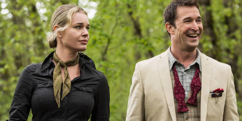 Eve Baird looks at a smiling Flynn Carsen in the woods in 'The Librarians.'