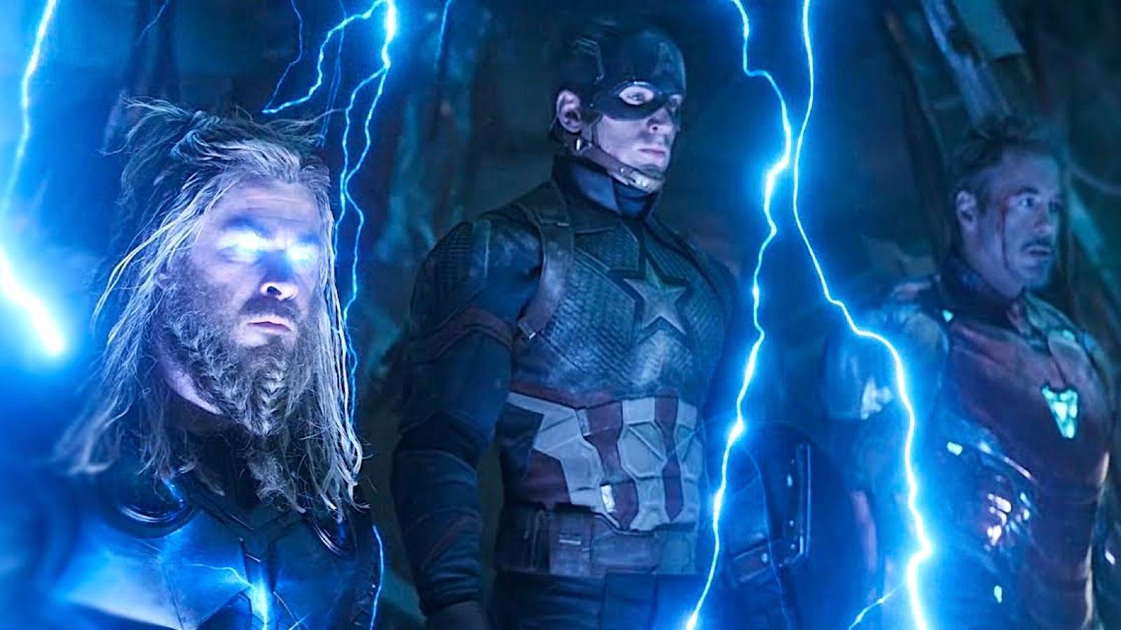 Thor, Captain America, and Iron Man look solemn as lightning crackles around them in 'Avengers: Endgame'.