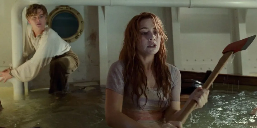 Rose (Kate Winslet) about to free Jack (Leonardo DiCaprio) from his handcuffs with an ax in 'Titanic'