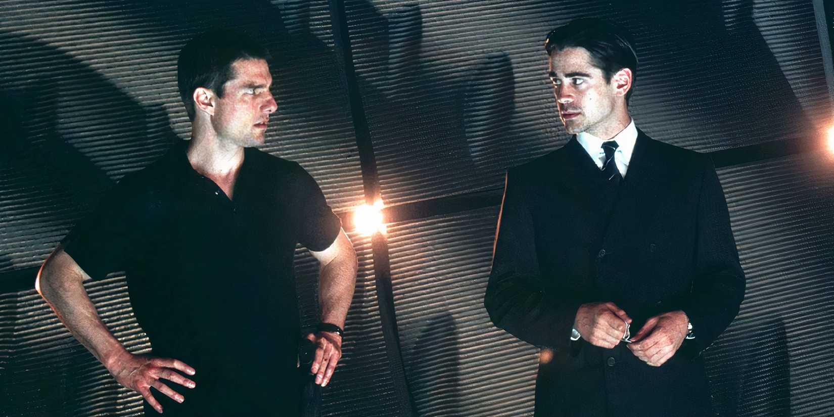 Tom Cruise as John Anderton and Colin Farrell as Danny Witwer in Minority Report looking at each other.