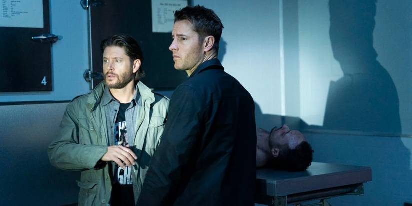 Jensen Ackles and Justin Hartley looking into the beam of a flashlight on Tracker