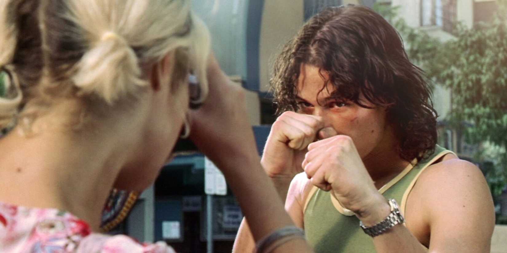 Jimmy (Heath Ledger), a young bouncer, strikes a boxing pose as Alex (Rose Byrne) takes his photo in "Two Hands” (1999).