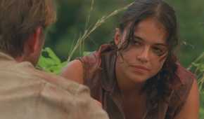 Ana Lucia (played by Michelle Rodriguez), confronts the imposter Goodwin (Brett Cullen), with a stoic look on her face in Lost’s Season 2 Episode ‘The Other 48 Days.’