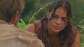 Ana Lucia (played by Michelle Rodriguez), confronts the imposter Goodwin (Brett Cullen), with a stoic look on her face in Lost’s Season 2 Episode ‘The Other 48 Days.’