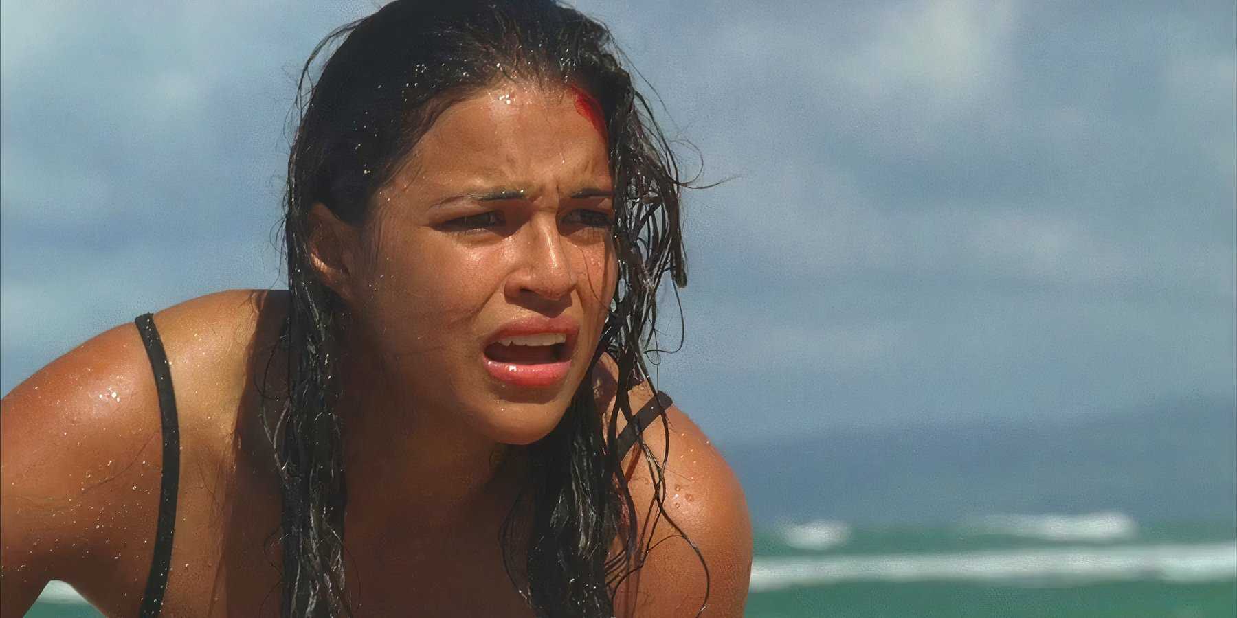 Ana Lucia (played by Michelle Rodriguez), gasps for air, having just washed up on shore after the crash of Oceanic Flight 815 in Lost’s Season 2 Episode ‘The Other 48 Days.’