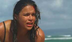 Ana Lucia (played by Michelle Rodriguez), gasps for air, having just washed up on shore after the crash of Oceanic Flight 815 in Lost’s Season 2 Episode ‘The Other 48 Days.’