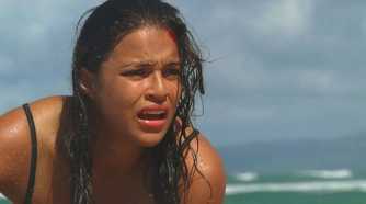 Ana Lucia (played by Michelle Rodriguez), gasps for air, having just washed up on shore after the crash of Oceanic Flight 815 in Lost’s Season 2 Episode ‘The Other 48 Days.’