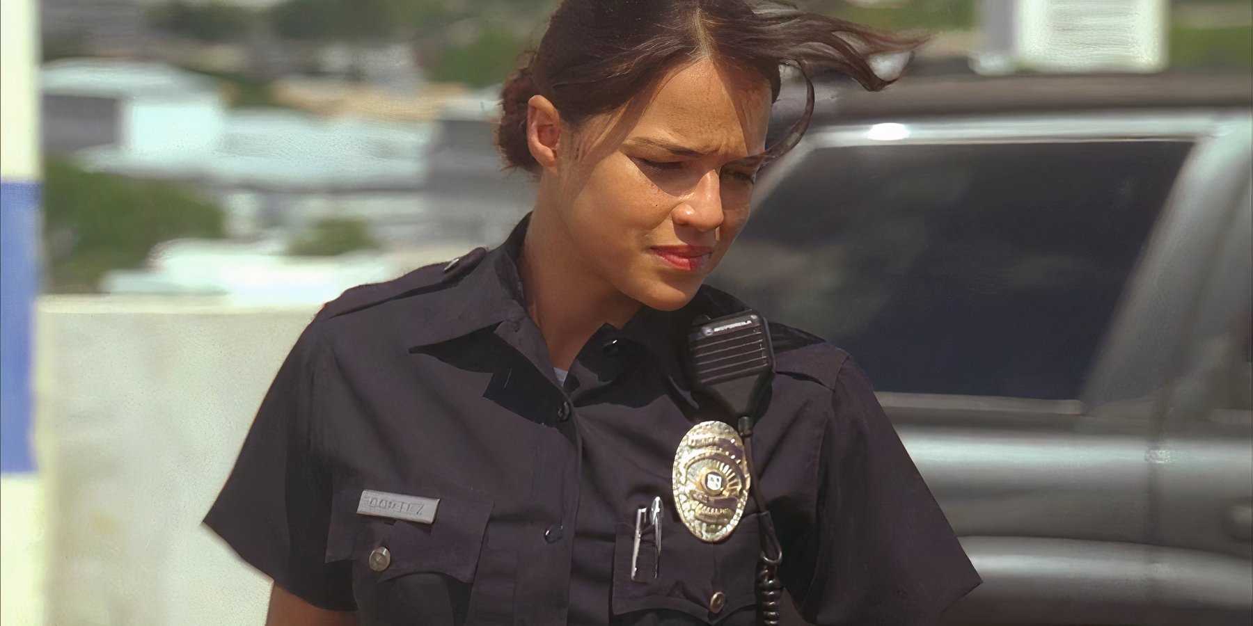 Ana Lucia (played by Michelle Rodriguez), leaves her squad car in her police uniform in Lost’s Season 2 Episode ‘Two for the Road.’