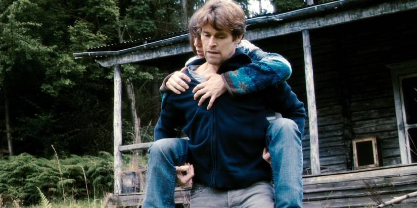 Willem Dafoe as He carrying Charlotte Gainsbourg as She in Antichrist