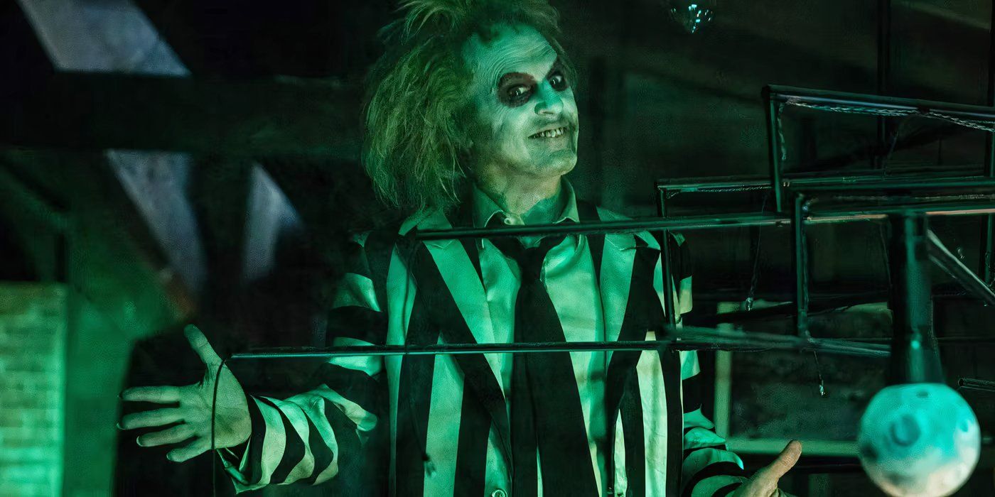 Beetlejuice with his arms wide in a ta-da motion in Beetlejuice Beetlejuice