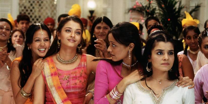 The cast of Bride and Prejudice, dressed in Desi clothing amongst a crowd.