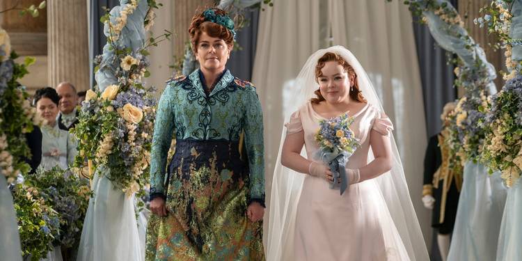 Polly Walker and Nicola Coughlan walking down the aisle at Colin and Penelope's wedding