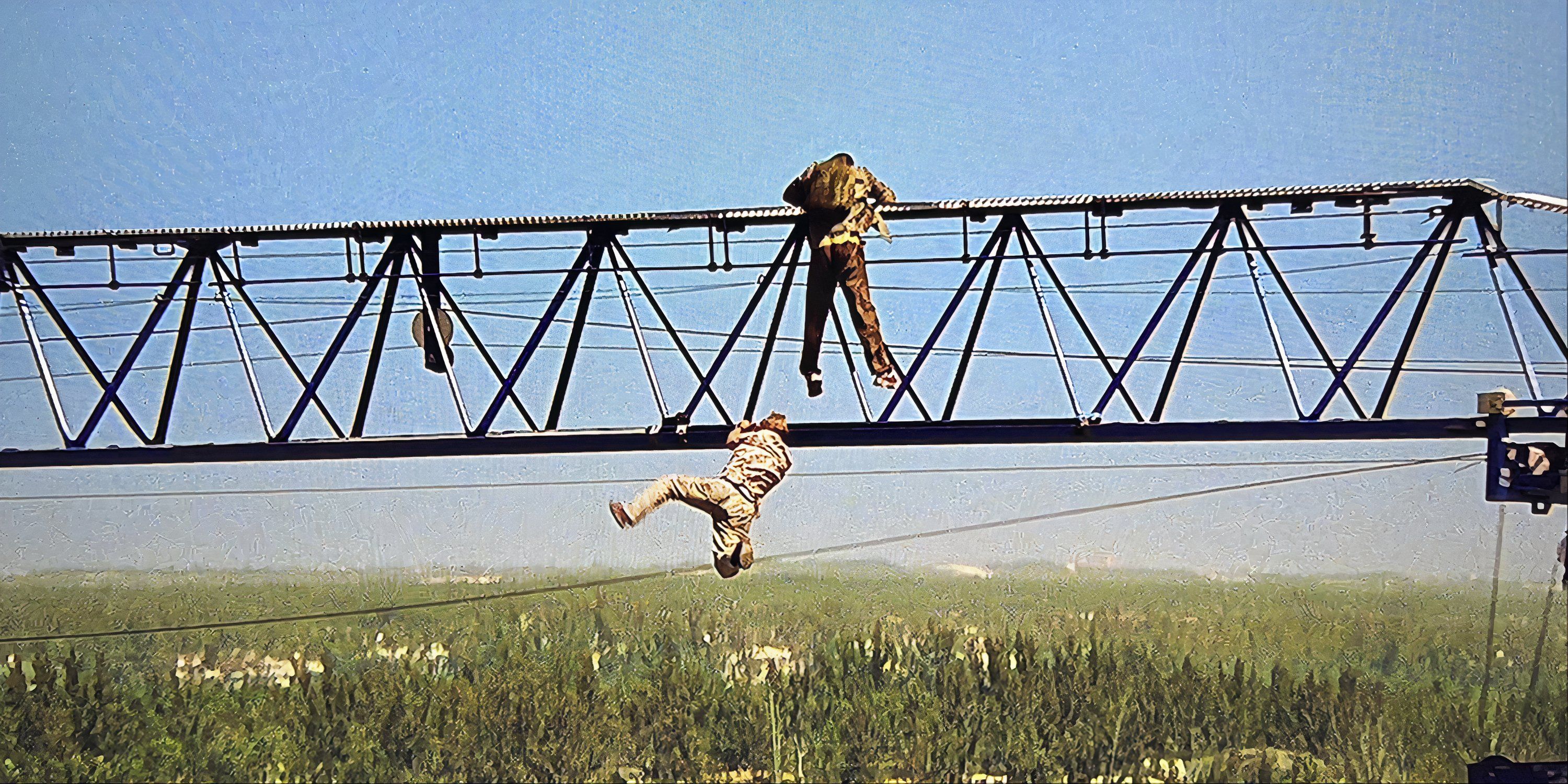 Daniel Craig and another man climbing a crane in Casino Royale