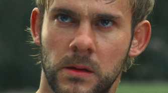 Charlie (played by Dominic Monaghan), looks into the distance with dread