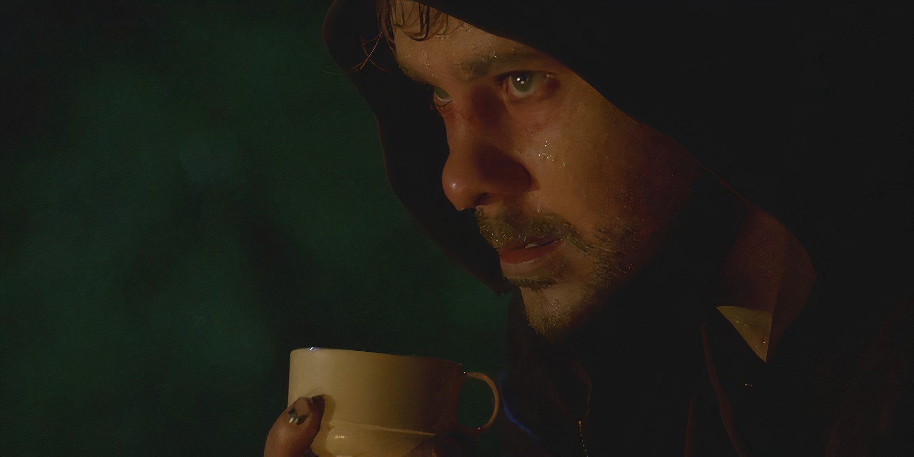 A sweat-soaked Charlie (Dominic Monaghan), battles heroin withdrawals while drinking tea in Lost.