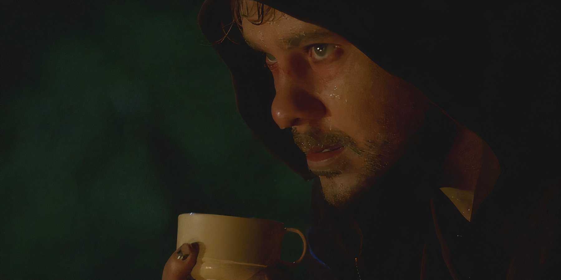 A sweat-soaked Charlie (Dominic Monaghan), battles heroin withdrawals while drinking tea in Lost.