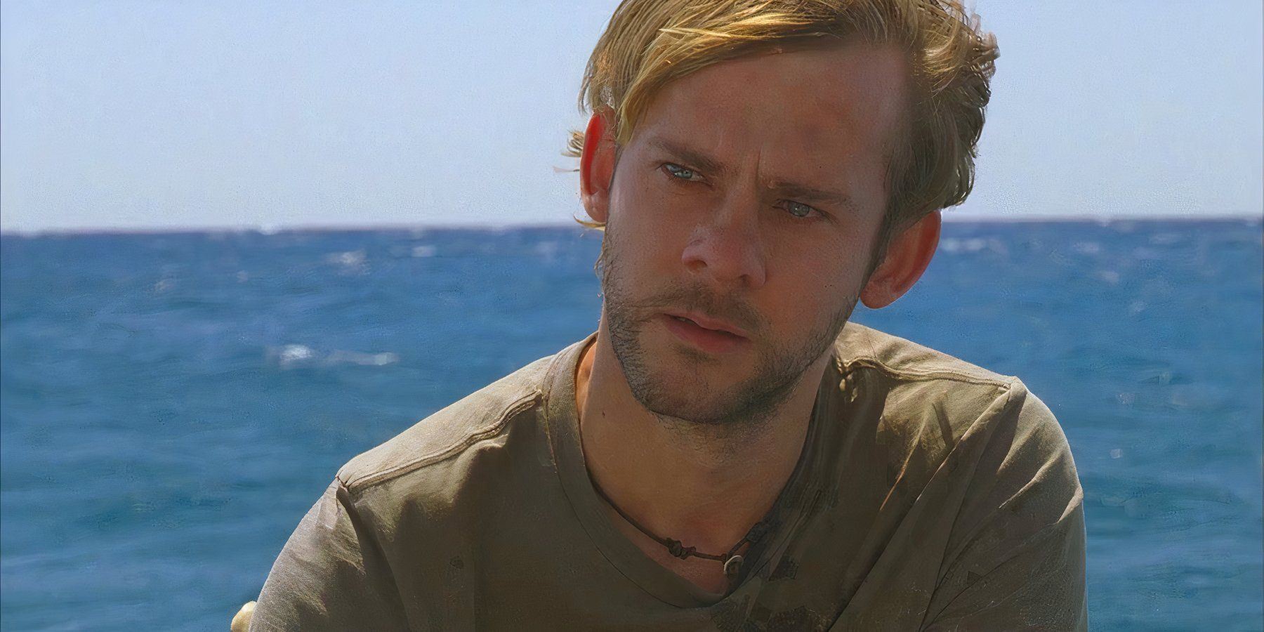Charlie (Dominic Monaghan), begins to cry on the beach