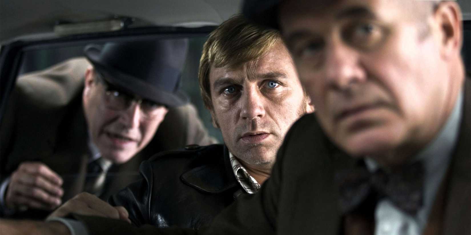 Steve in a car with two other men looking ahead in Munich