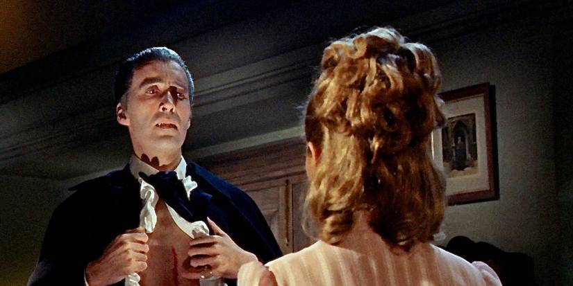Dracula showing his chest to a woman in Deacula: Prince of Darkness