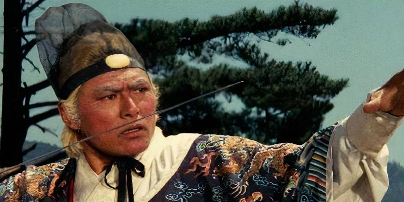 An aging warrior poses with his jian with a confused look on his face