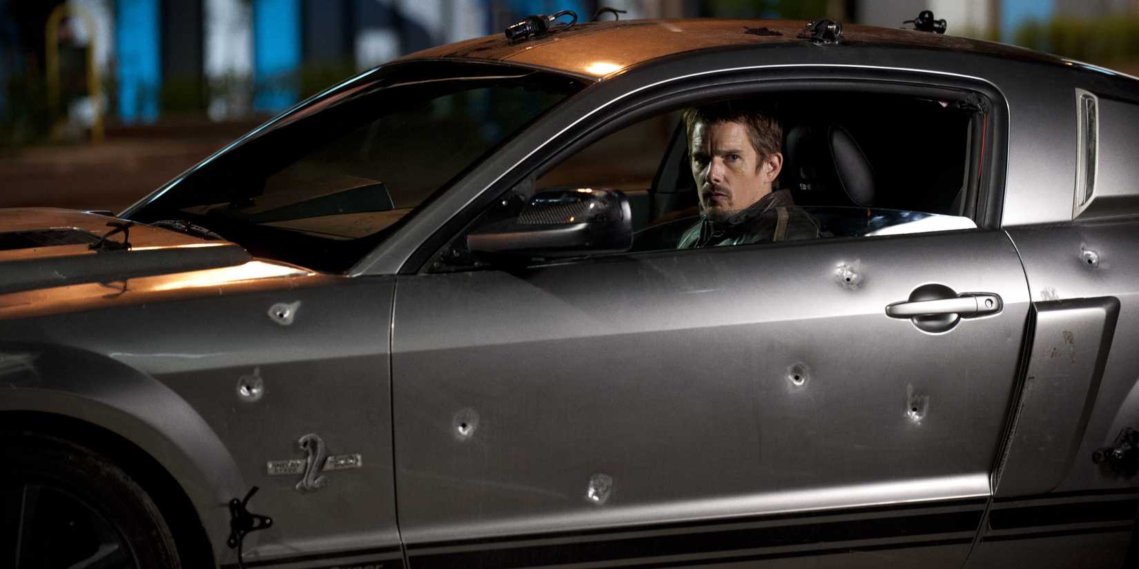 Ethan Hawke drives a car with bullet holes in 'Getaway' (2013)