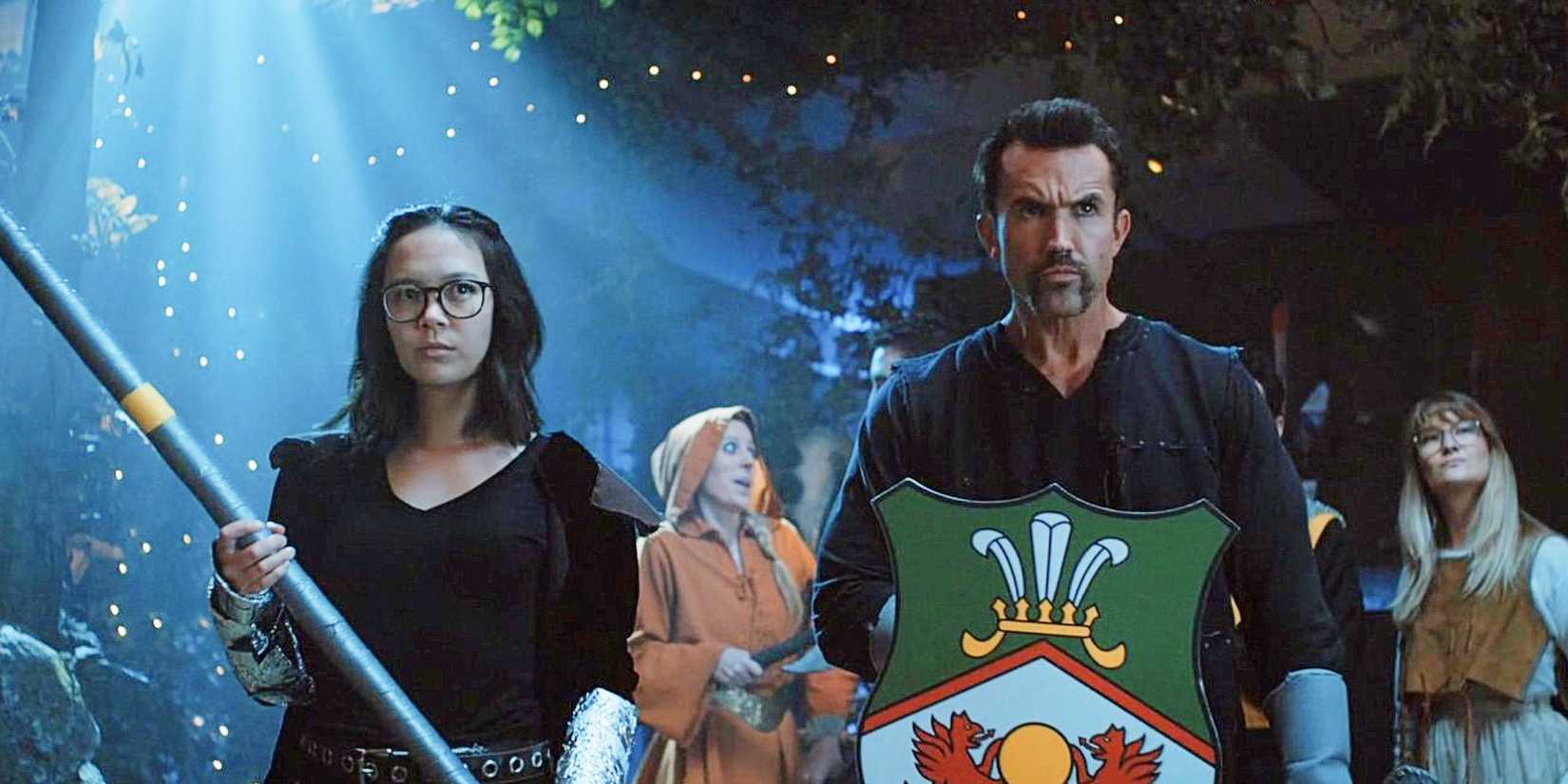 Poppy Li and Ian Grimm holding swords and shields in Mythic Quest 'Everlight'.