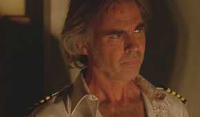 Frank Lapidus (played by Jeff Fahey), narrows his eyes in concern in one of the Dharma cabins in Lost’s Season 5 Episode Dead is Dead.