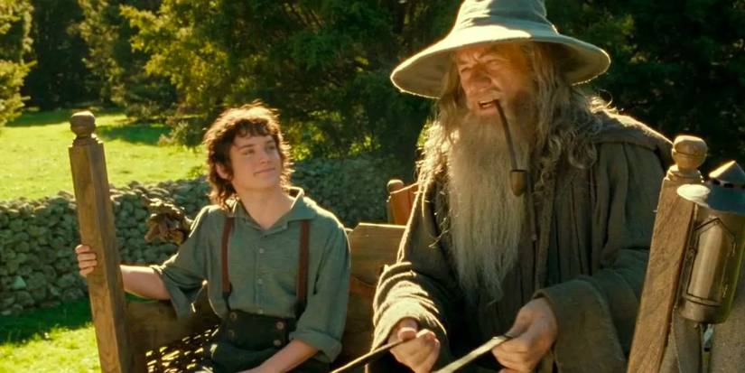 Frodo Baggins (Elijah Wood) and Gandalf (Ian McKellen) on a carriage in The Fellowship of the Ring.