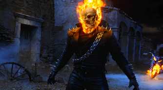 A flaming Ghost Rider wanders through an abandoned churchyard in Ghost Rider.