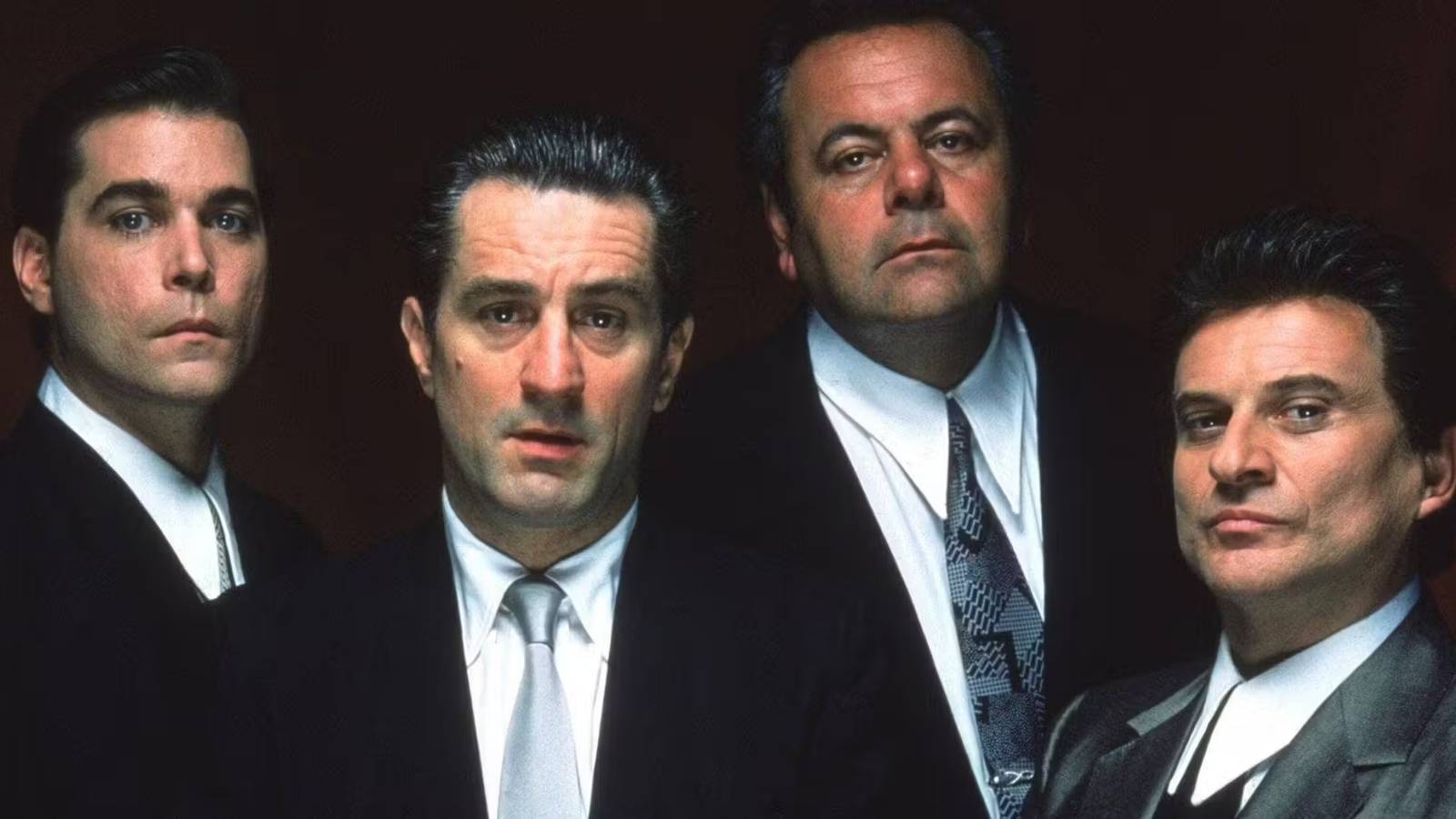The main cast of Goodfellas looking at the screen.